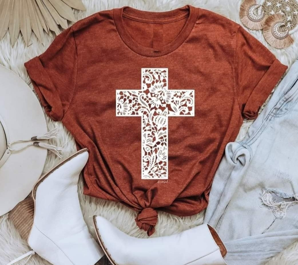 Lace cross on rust Bella Canvas shirt.